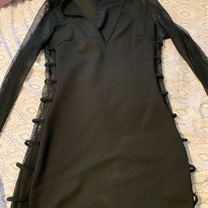 Black fitted dress with sheer sleeves and sides